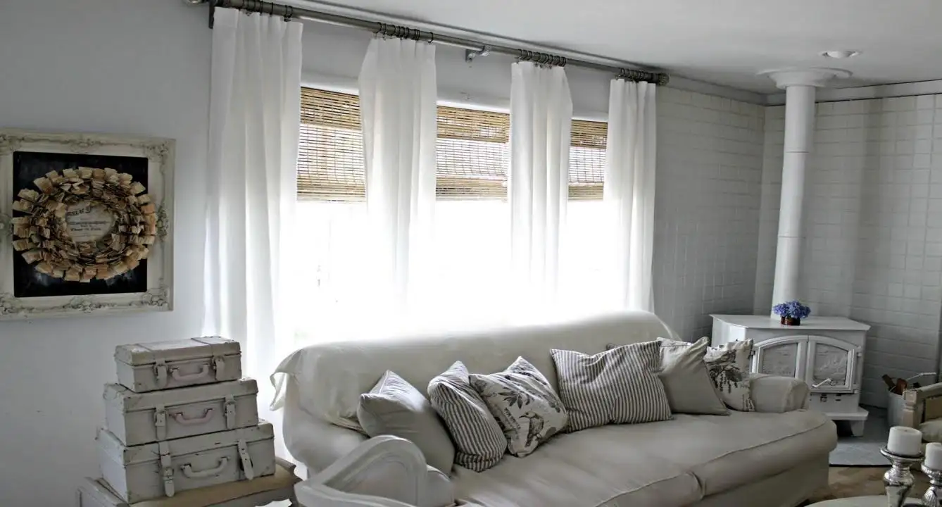 Combining sheer curtains with woven wood shades