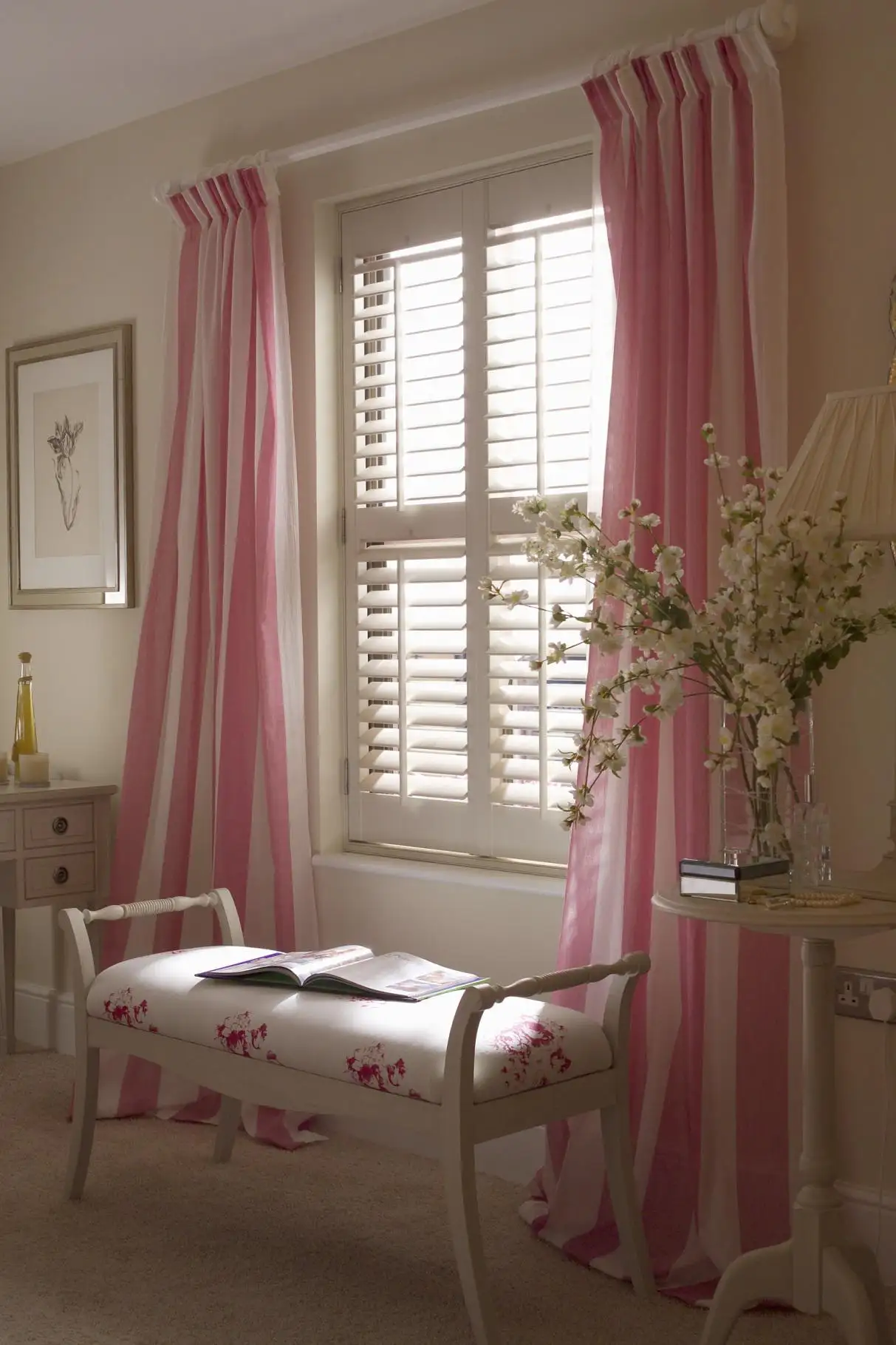 Combining plantation shutters with drapes